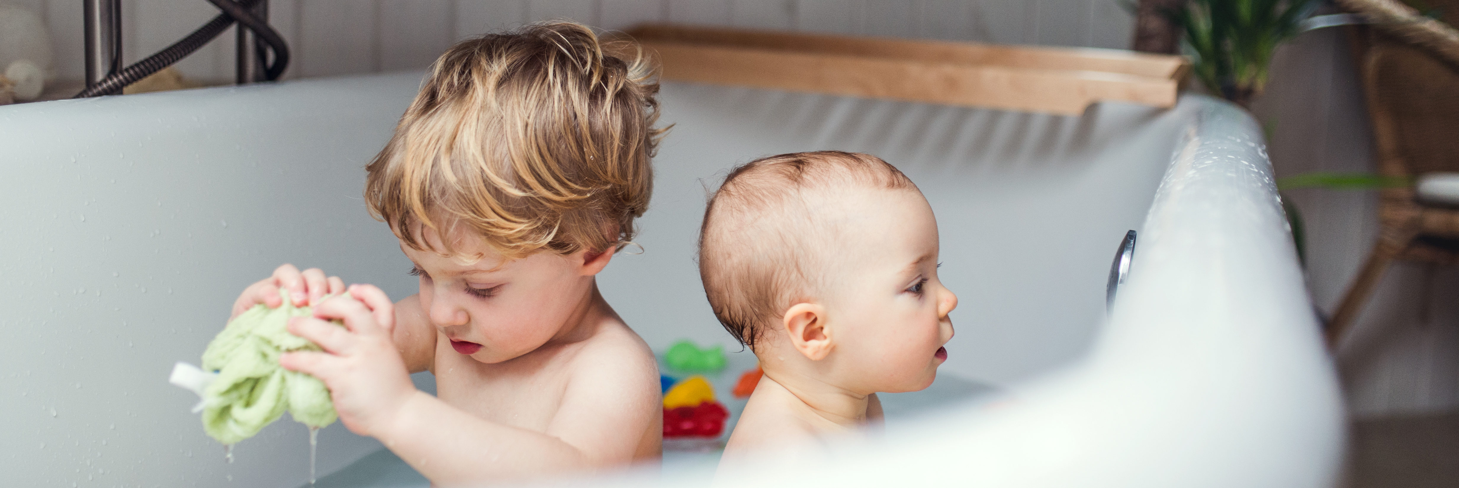 Two Toddler Children Having A Bath