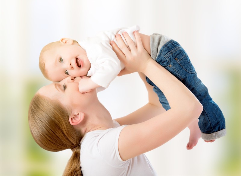 woman holding baby