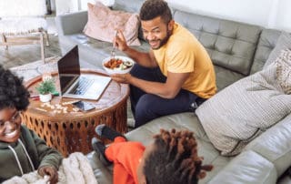 family sitting on the couch in the living room