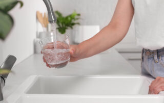 filling water glass at sink