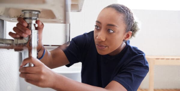 employee working on plumbing