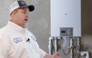 employee talking about tankless water heater