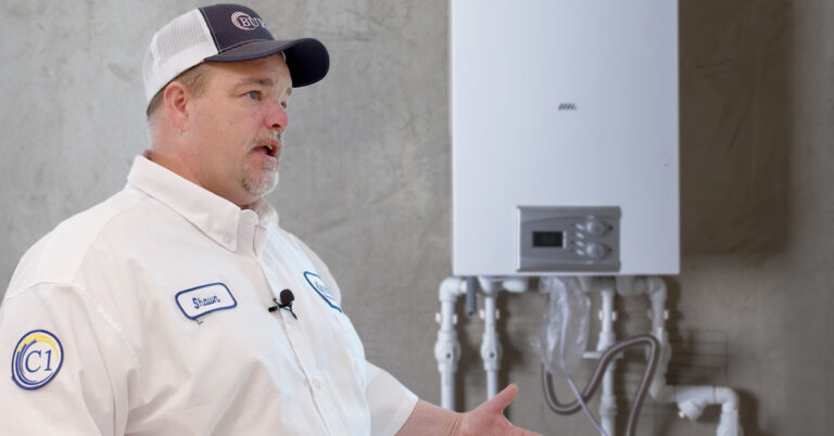 employee talking about tankless water heater