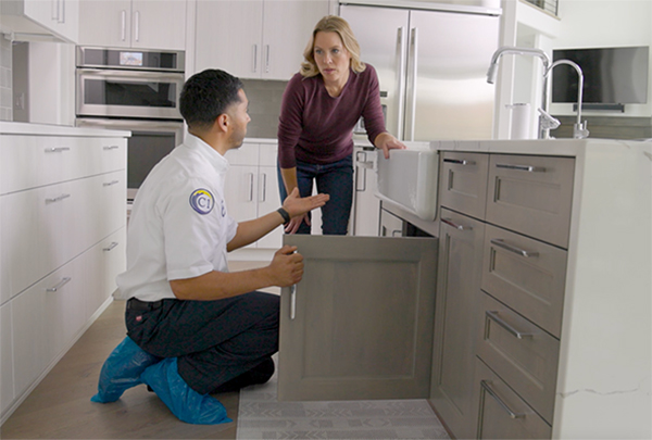 plumber cleaning drain